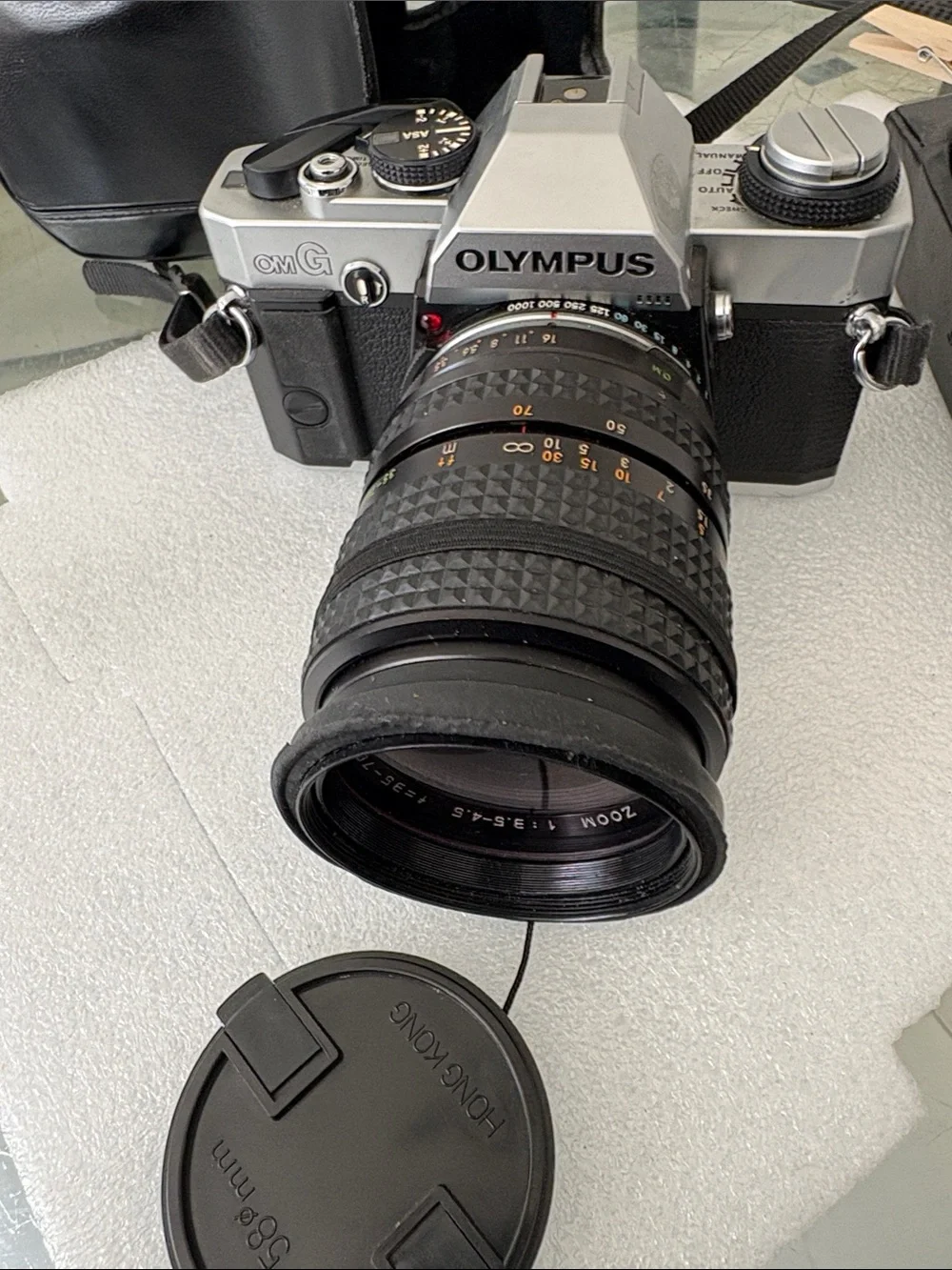 Olympus Silver and Black 35mm SLR Camera with Black Zoom Lens parts not tested